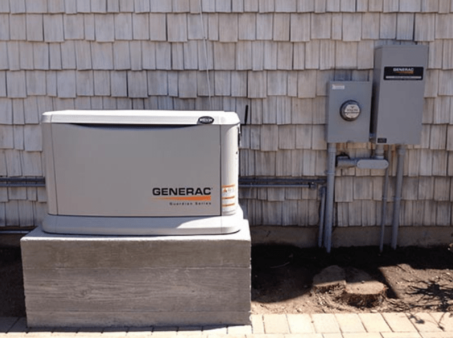 Generac Generator on Raised Concrete Pad with Electrical Meter and Transfer Switch (ATS)