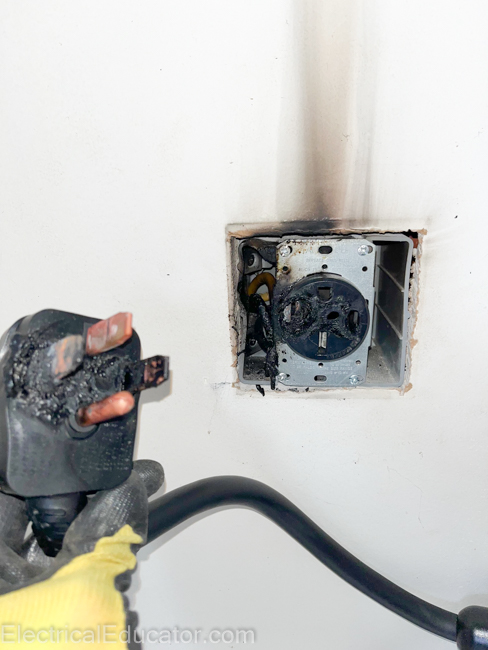 burned NEMA 14-50 plug end and receptacle